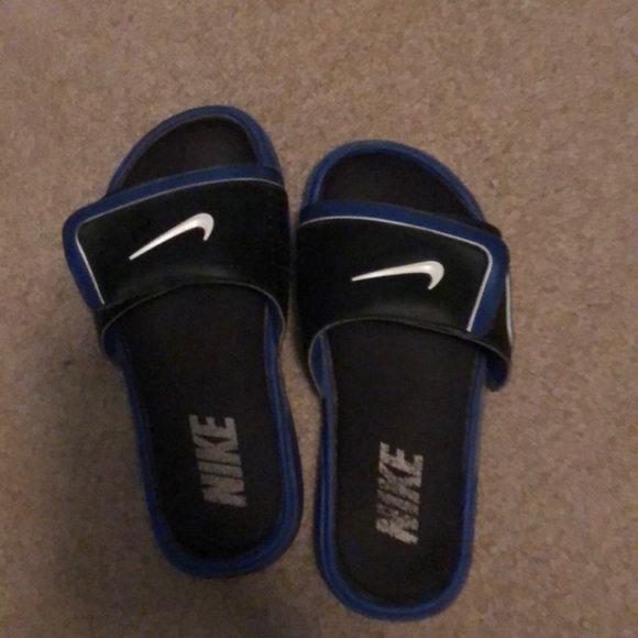 blue and black nike slides
